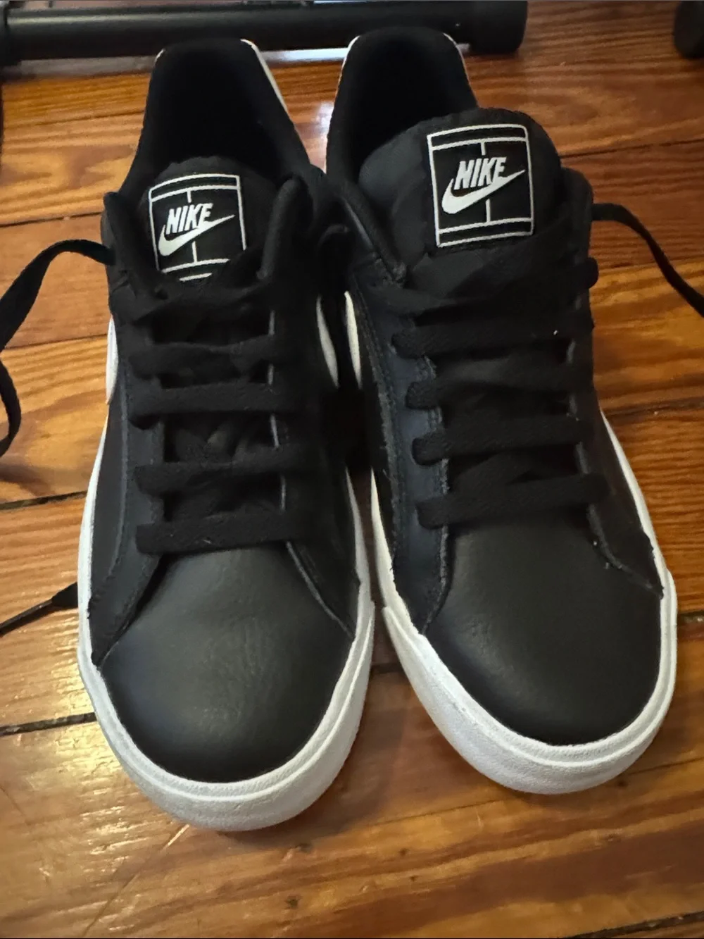 Nike Black Low-Top Sneakers with White Swoosh